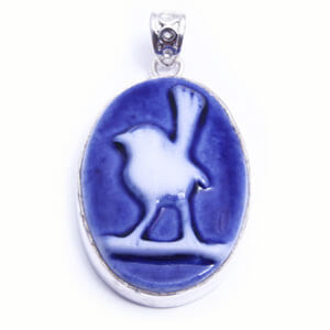 Wren, hand carved porcelain pendant set in sterling silver. Available in four colours