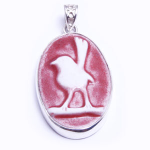 Wren, hand carved porcelain pendant set in sterling silver. Available in four colours.