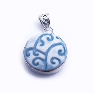 Riccioli - a round hand carved porcelain pendant set in sterling silver. Available in light blue, blue, red and grey.
