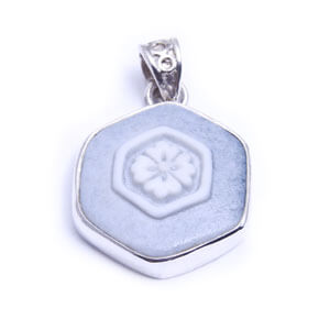 Hana is a hand carved hexagonal porcelain pendant glazed and set in sterling silver. Available in light blue, red, blue and grey.