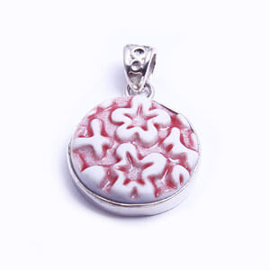 Petit - a round handmade porcelain pendant set in sterling silver. Available in red, blue, grey and light blue.