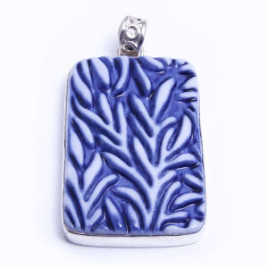 Bamboo is a hand carved rectangular porcelain pendant glazed and set in sterling silver. Available in blue, grey, red and light blue.