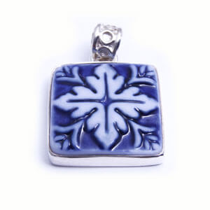 Mosaic is a hand carved square porcelain pendant glazed and set in sterling silver. Available in red, blue, grey and light blue.