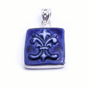 Flordelis is a hand carved rectangular porcelain pendant glazed and set in sterling silver. Available in blue, light blue, red and grey.