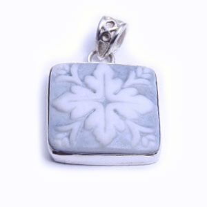 Mosaic is a hand carved square porcelain pendant glazed and set in sterling silver. Available in red, blue, grey and light blue.
