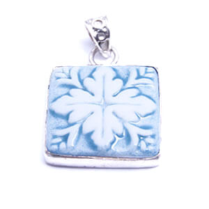 Mosaic is a hand carved square porcelain pendant glazed and set in sterling silver. Available in red, blue, grey and light blue.