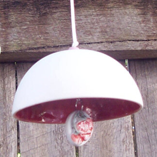 A delicate single bell with a decorative clapper