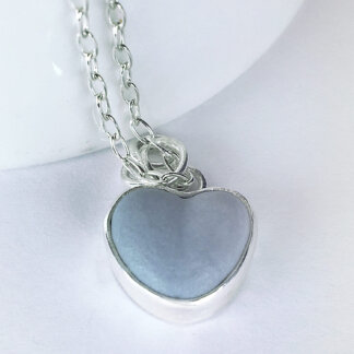 light blue porcelain set in silver little charm in a silver chain