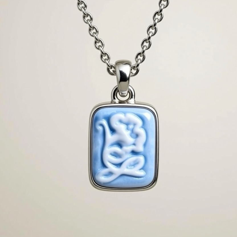 blue porcelain and silver cameo charm in a silver necklace