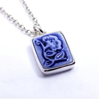 blue porcelain and silver cameo charm in a silver necklace