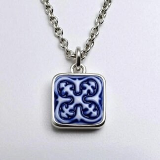 porcelain and silver cameo charm in a silver necklace