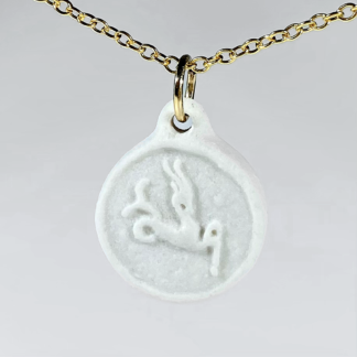 Capricorn white porcelain coin medallion with gold chain