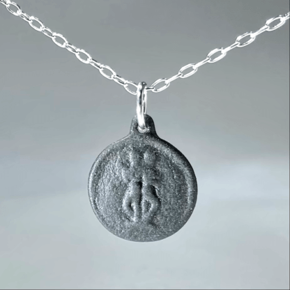 Gemini black porcelain coin medallion with silver chain