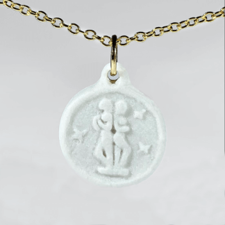 Gemini white porcelain coin medallion with gold chain