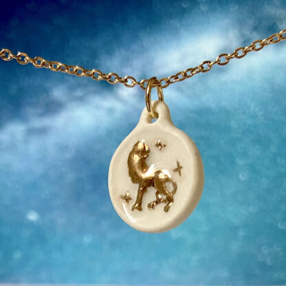 Leo white porcelain and gold coin medallion with a gold chain