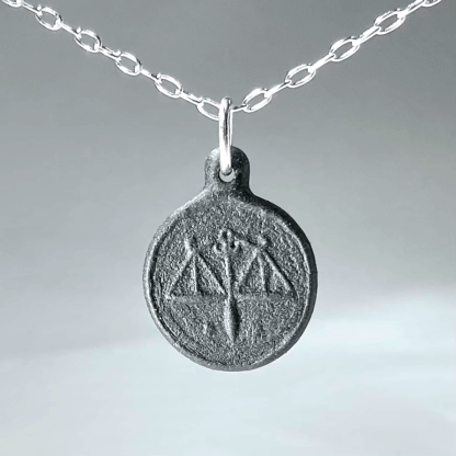 Libra black porcelain coin medallion with silver chain