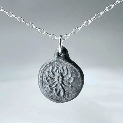 Scorpio black porcelain coin medallion with silver chain