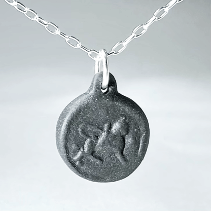 Taurus black porcelain coin medallion with silver chain