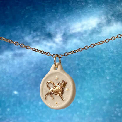 Taurus white and gold porcelain coin medallion with gold chain