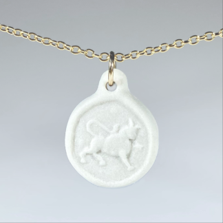 Taurus white porcelain coin medallion with gold chain