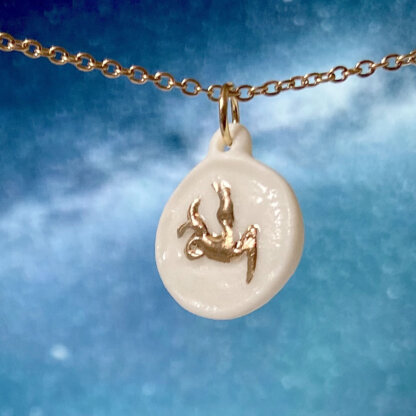 Capricorn white and gold porcelain coin medallion with gold chain