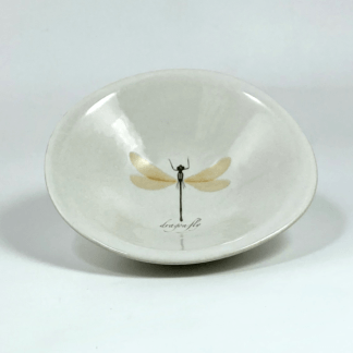 little porcelain bowl with a dragonfly drawing in the middle