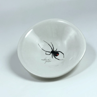small porcelain bowl with a spider drawing in the centre